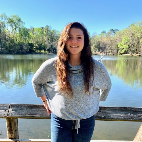 Brianna Coia posing on a bridge above water